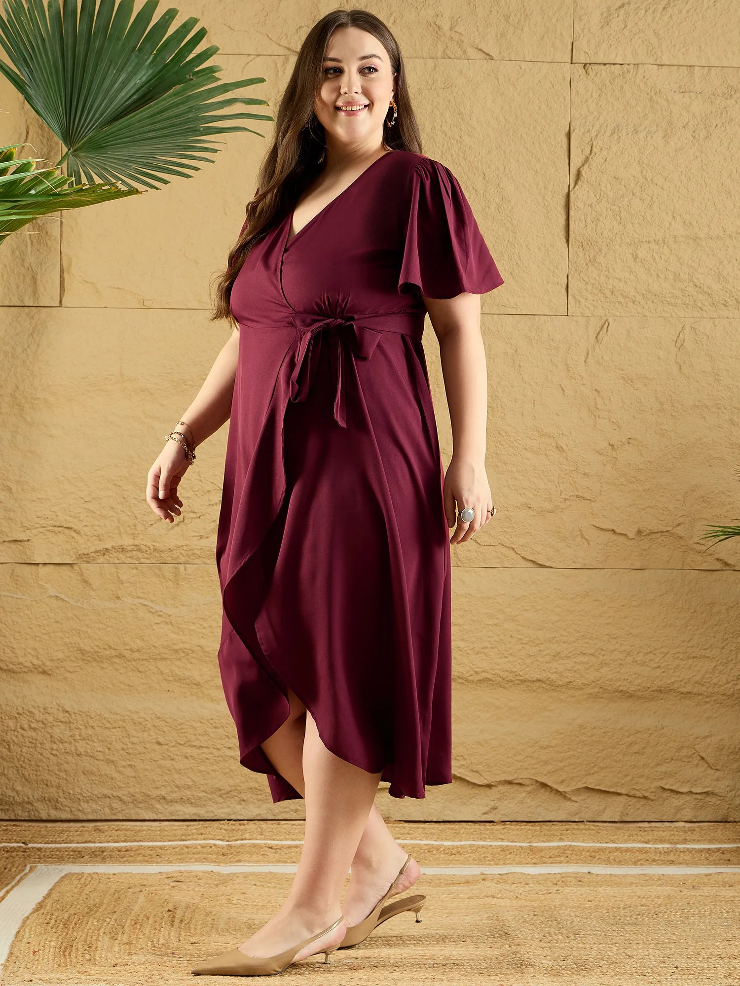 Berrylush Curve Women Solid Maroon V-Neck Flared Sleeves Tie-Up Waist Asymmetrical Hem Wrap Ruffled Maxi Dress