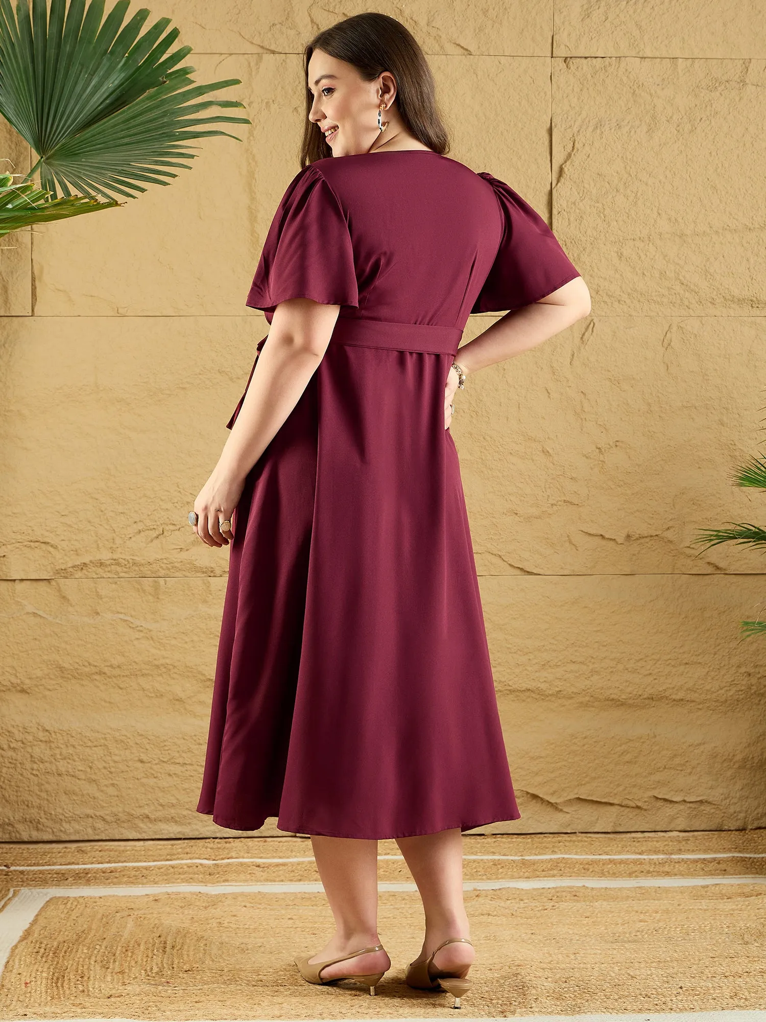 Berrylush Curve Women Solid Maroon V-Neck Flared Sleeves Tie-Up Waist Asymmetrical Hem Wrap Ruffled Maxi Dress